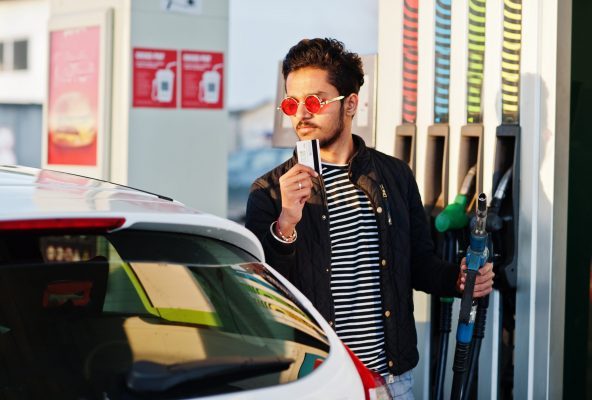 south-asian-man-indian-male-refueling-his-white-car-gas-station-hold-credit-card-scaled-ql96g4f606hzikgyvdqhitf4r9oejh6vc2q6hdbov4